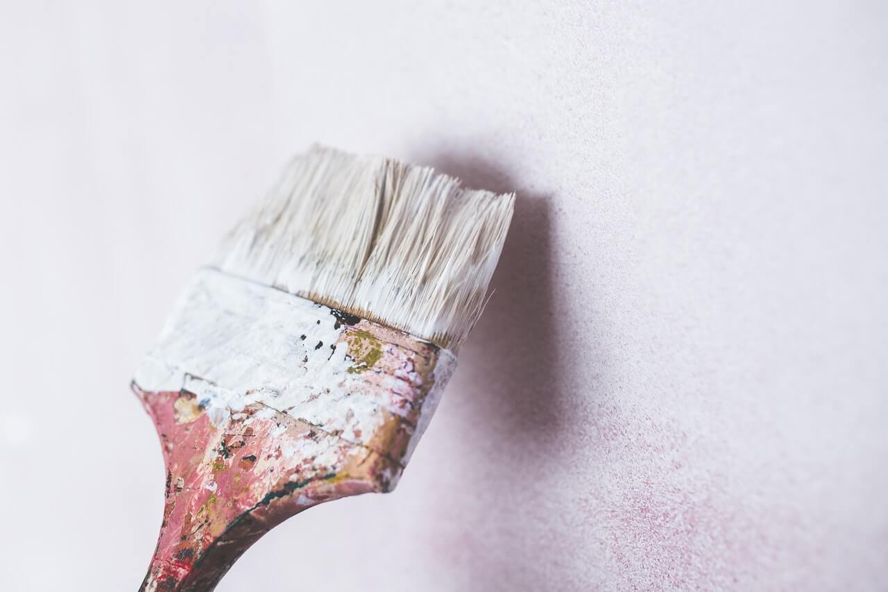 white paint brush on wall